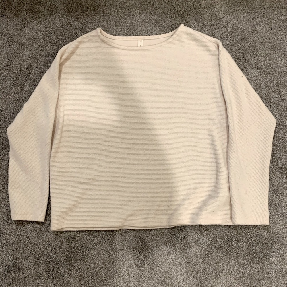 Cream Sweater with a ribbed texture